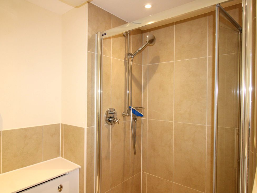 A shower with glass enclosure at 4 Bolt Head Salcombe