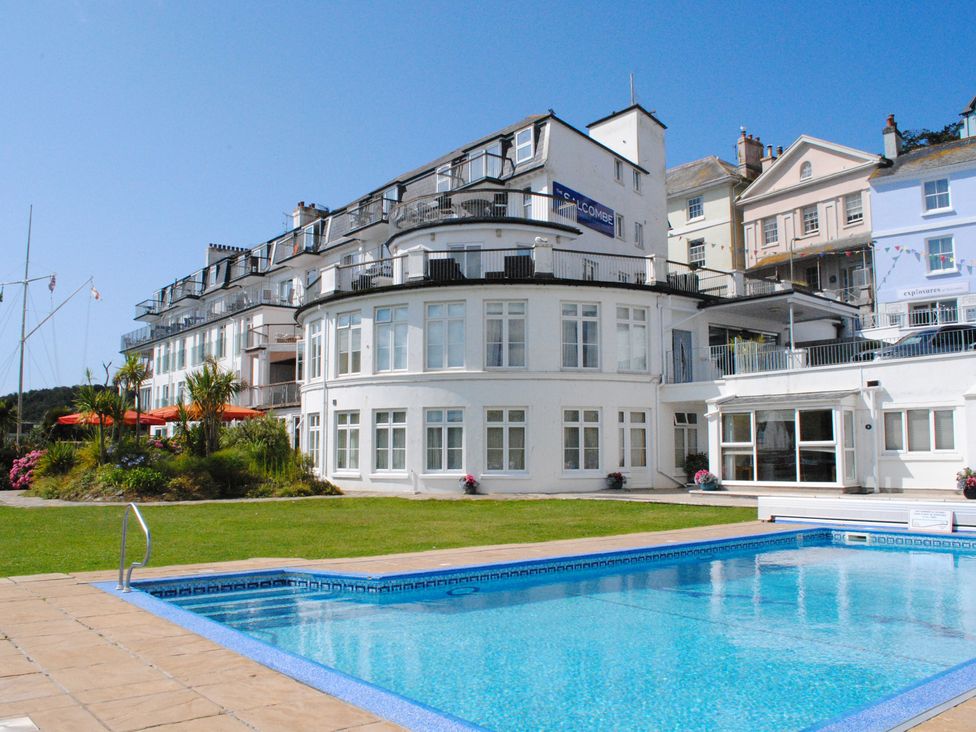 An outdoor area with a pool and building at 4 The Salcombe Salcombe