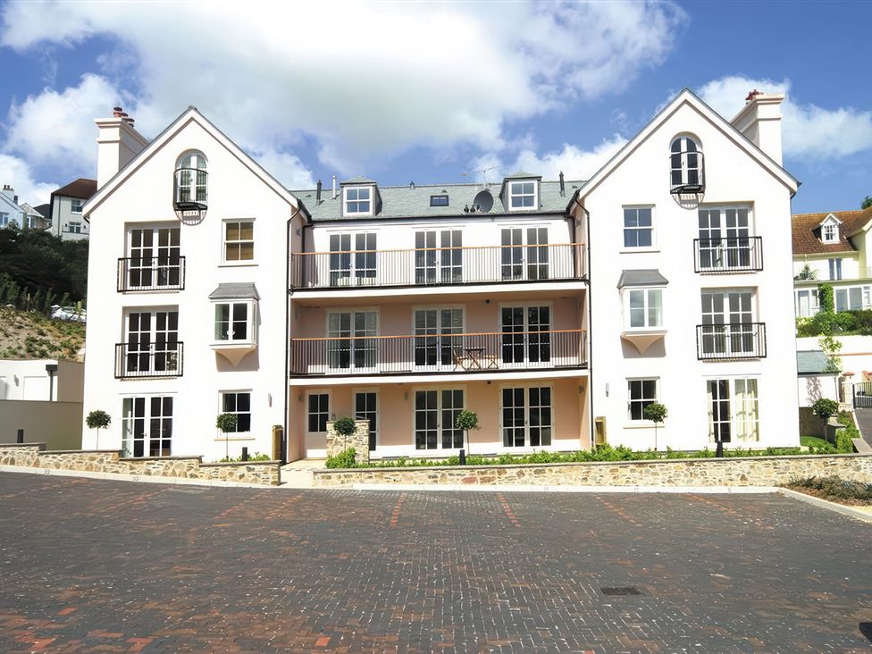A building with balconies and windows at 6 Combehaven Salcombe