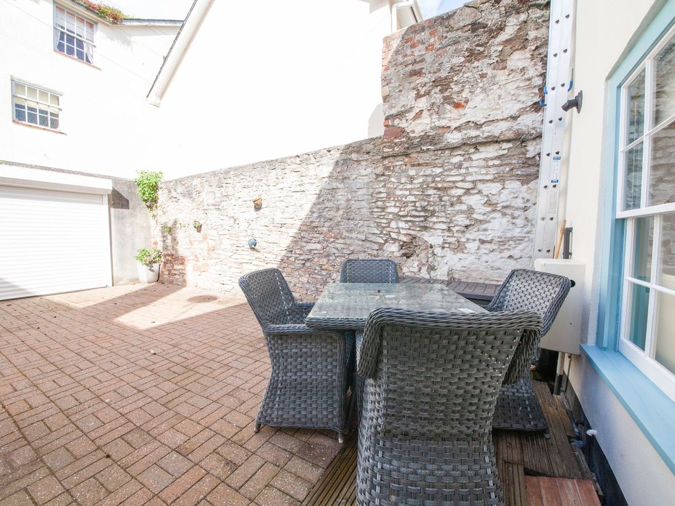 An outdoor area with a table and chairs at 7 Charles Street Dartmouth