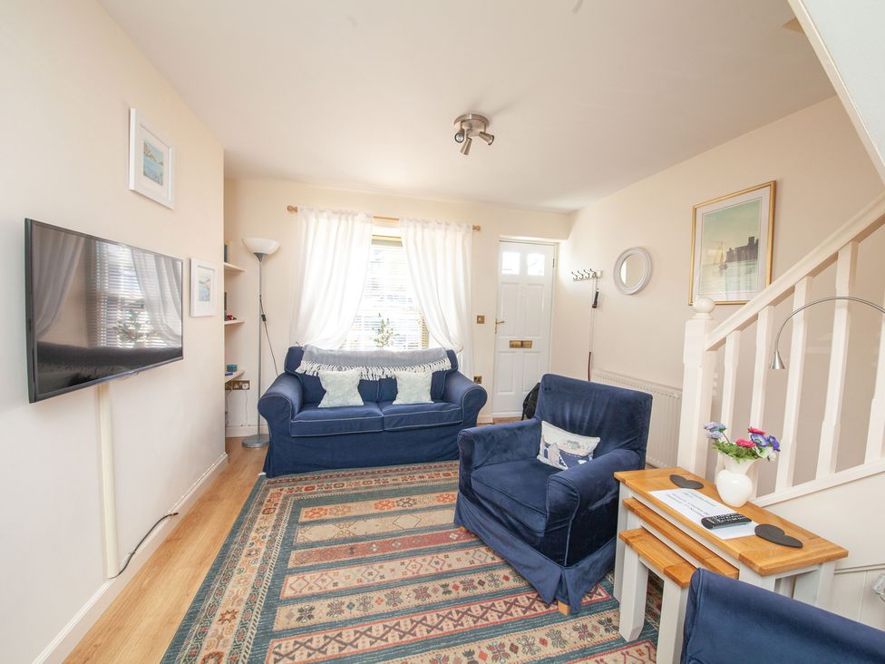 A living room with furniture and a television at 7 Charles Street Dartmouth