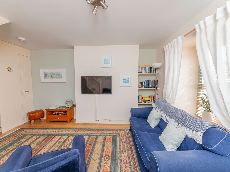 A living room with a sofa and television at 7 Charles Street Dartmouth