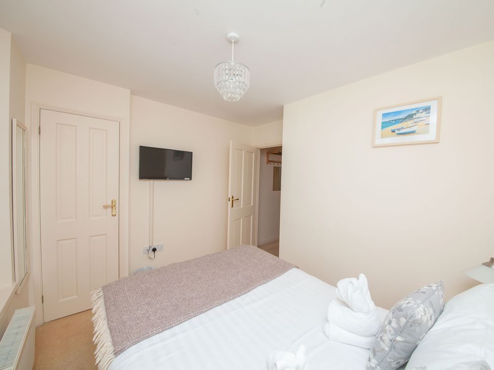 A bedroom with a bed and TV at 7 Charles Street Dartmouth