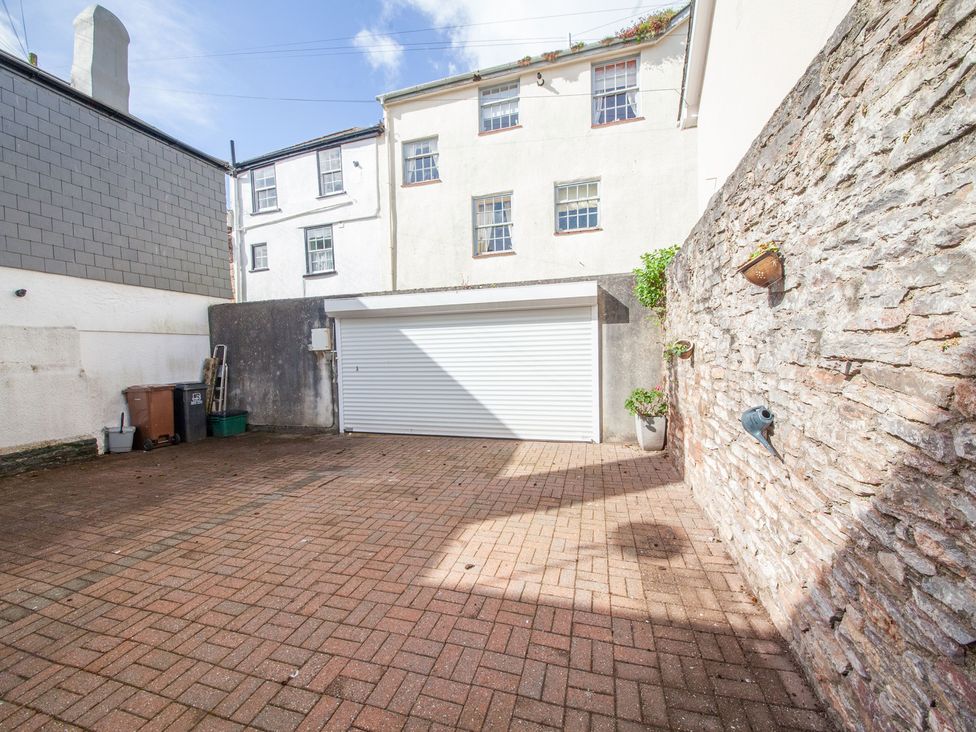 An outdoor area with a garage door and paved surface at 7 Charles Street Dartmouth