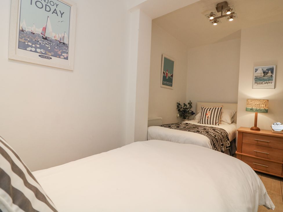 A bedroom with beds and wall art at Dart Views in Dartmouth