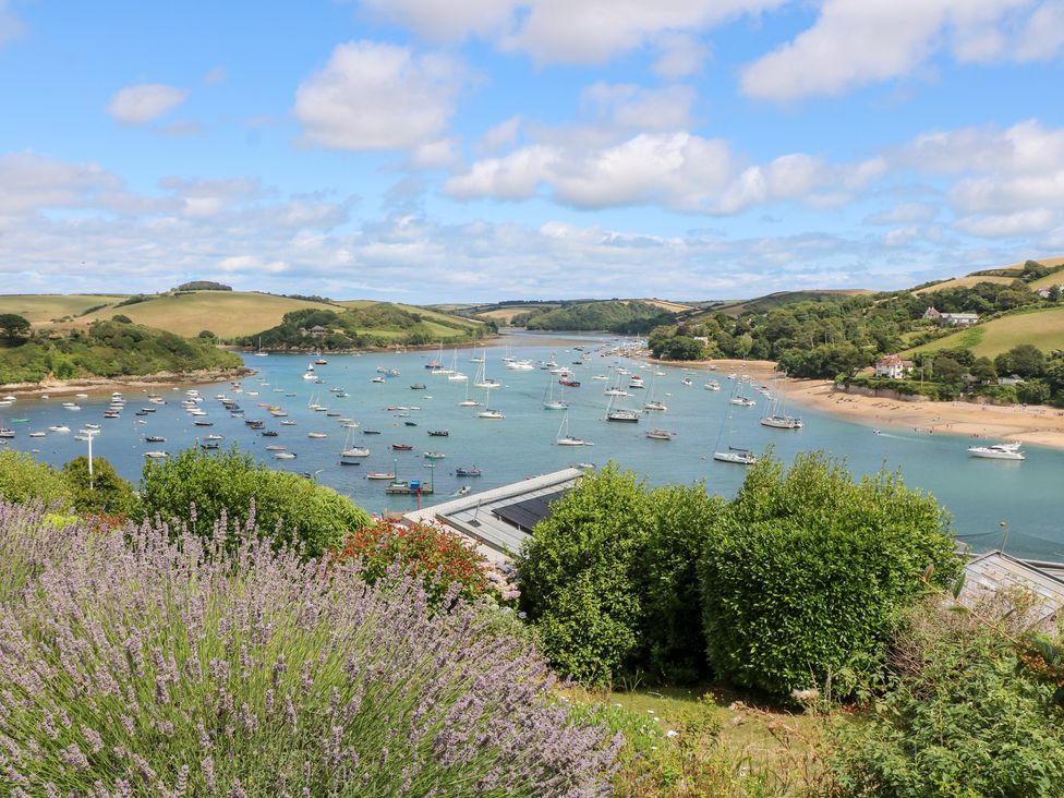 A view of water with boats and hills at Edinburgh House in Salcombe