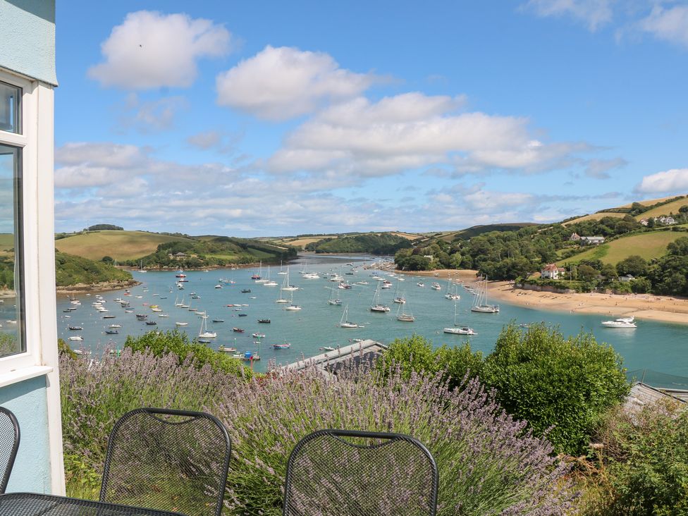 A view of boats on water surrounded by hills at Edinburgh House in Salcombe