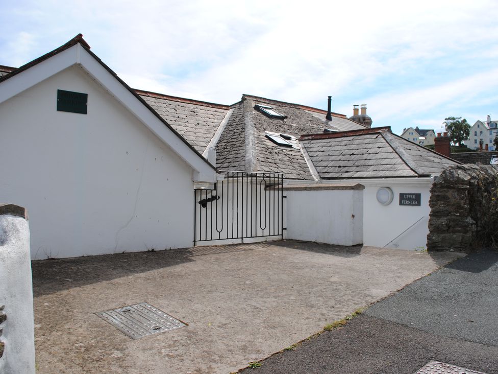 An outdoor view of a property with a gate and signage at Upper Fernlea in Salcombe