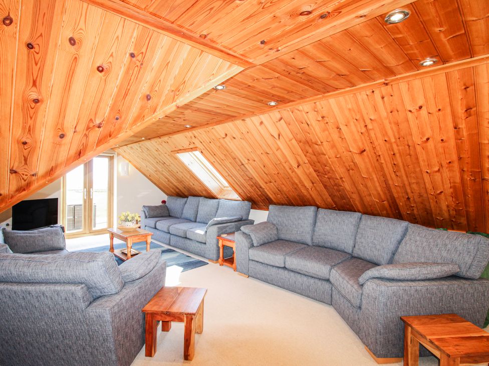 A living room with sofas and a table at The Station in Bolberry