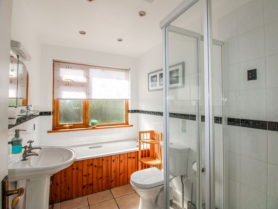 A bathroom with a sink, toilet, shower, and bathtub at The Station in Bolberry