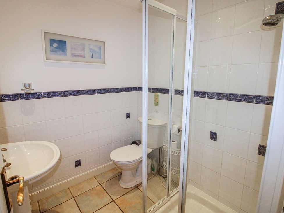 A bathroom with a shower and toilet at The Station in Bolberry