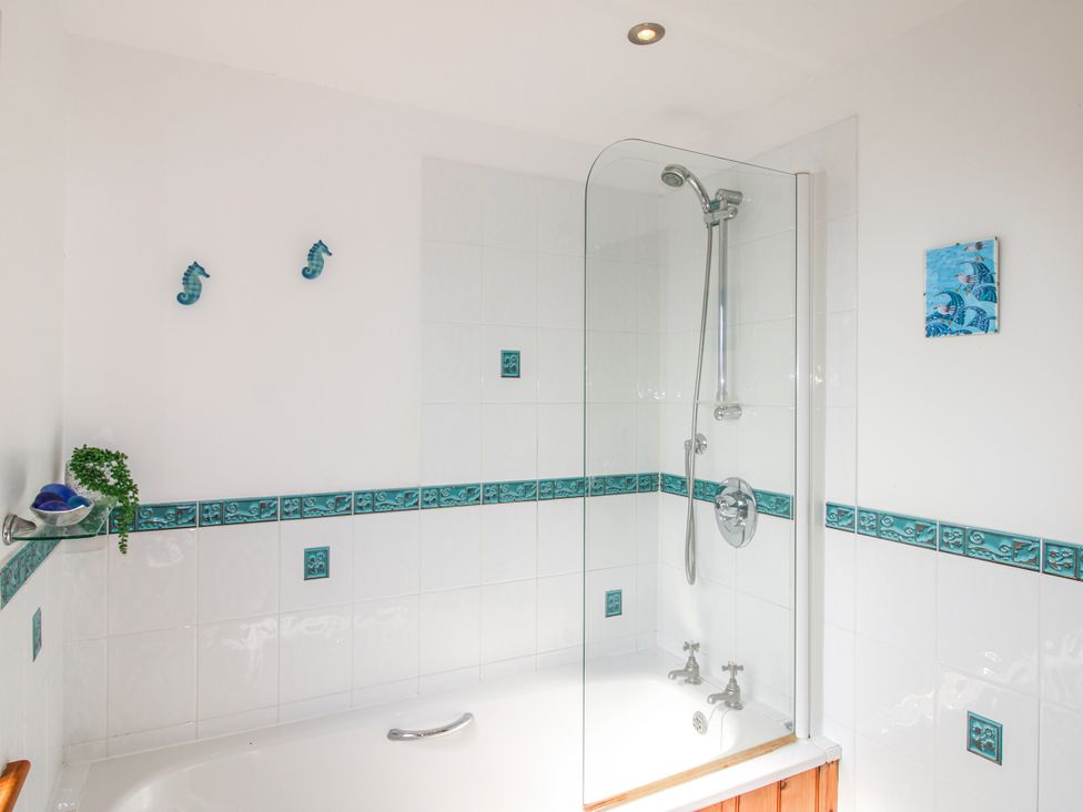 A bathroom with a bathtub and shower at The Station in Bolberry