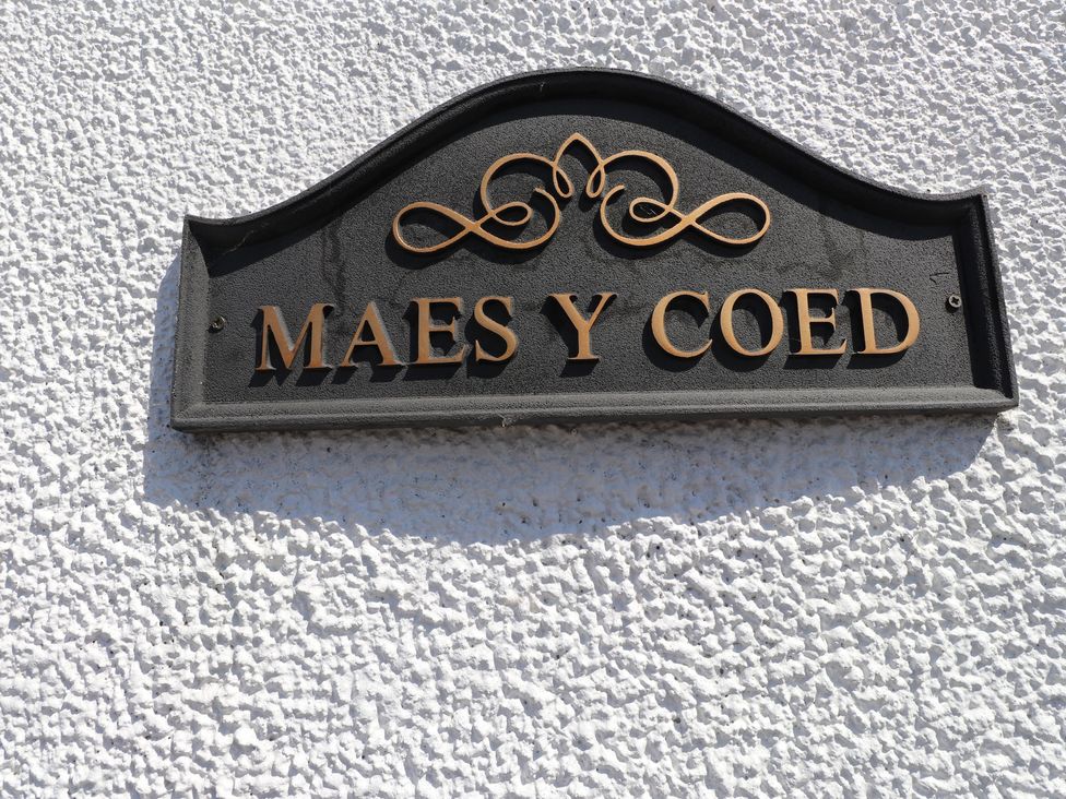 A sign reading Maes Y Coed