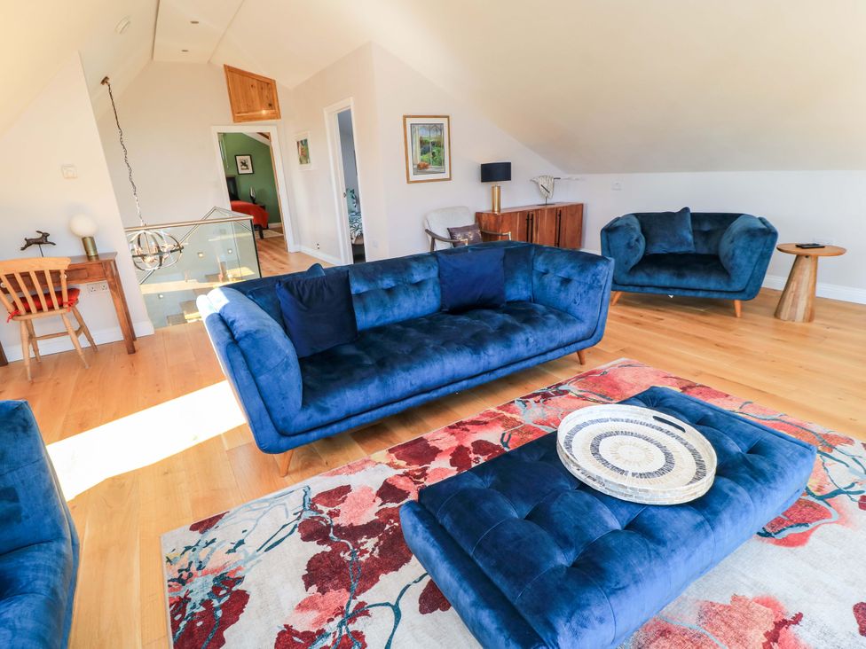 A living room with sofas and a coffee table at The Old Dairy Cotleigh near Honiton