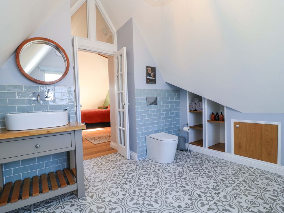 A bathroom with a sink and toilet at The Old Dairy Cotleigh near Honiton