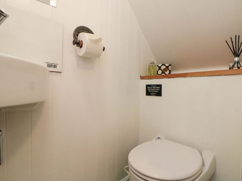 A bathroom with a sink and toilet at Saints Cottage in Scarborough