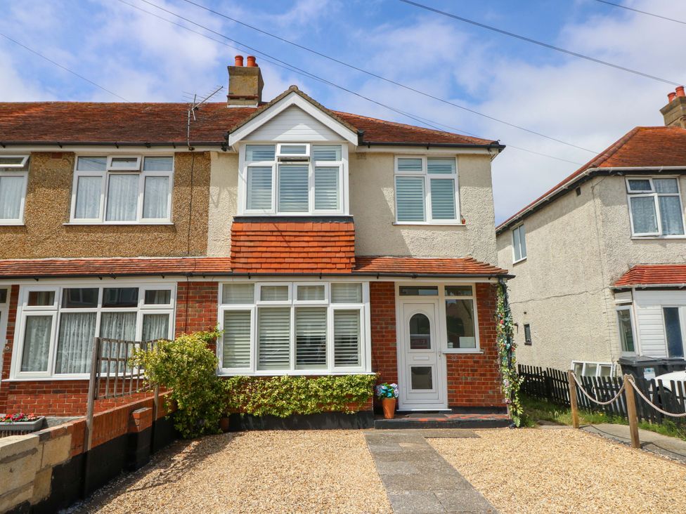 A house with gravel driveway and plants at 32 Cranleigh Close Tuckton