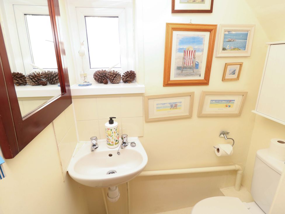 A bathroom with a sink and toilet at 32 Cranleigh Close Tuckton