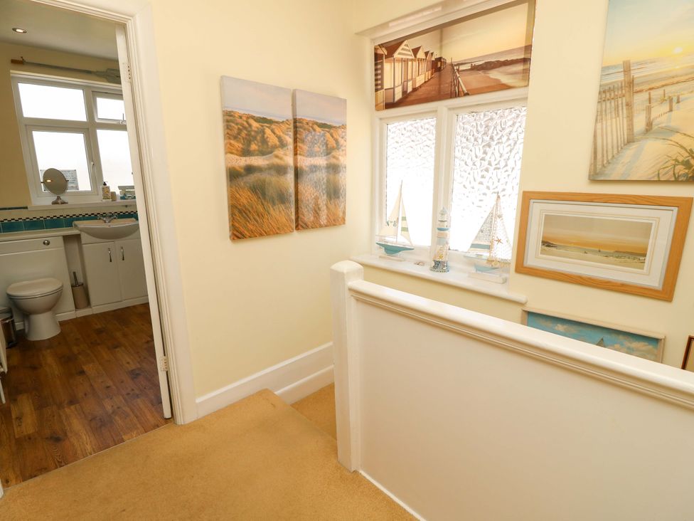 A hallway with a view of a bathroom at 32 Cranleigh Close Tuckton