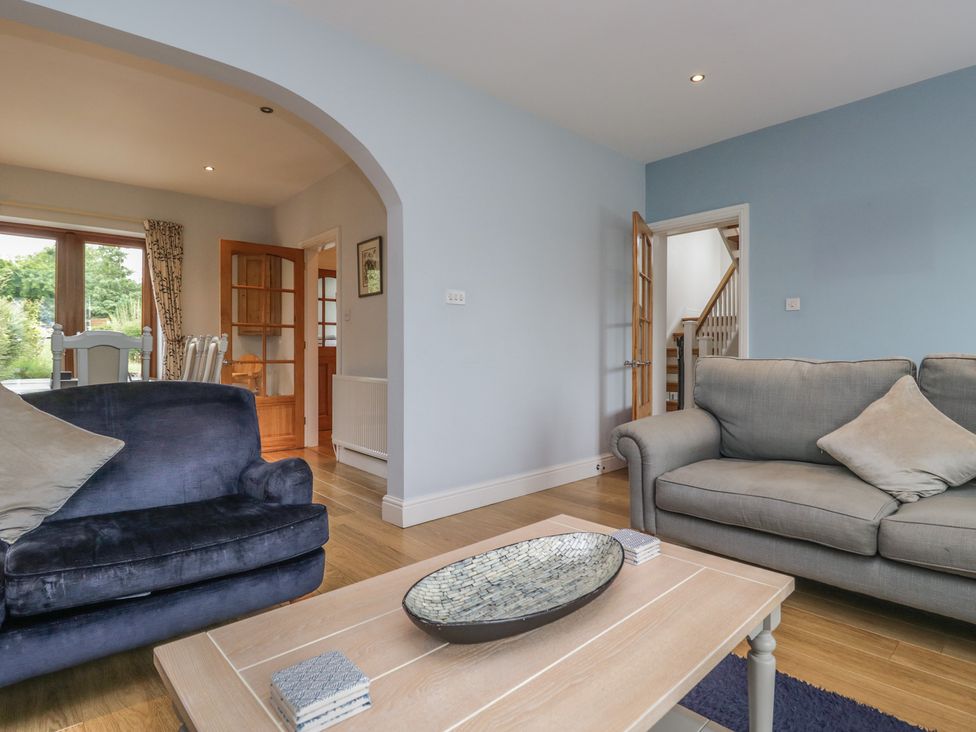 A living room with a sofa and coffee table at Langtree in Arnside