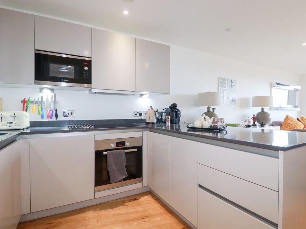 A kitchen with appliances and utensils at Apartment no.21 in Newquay
