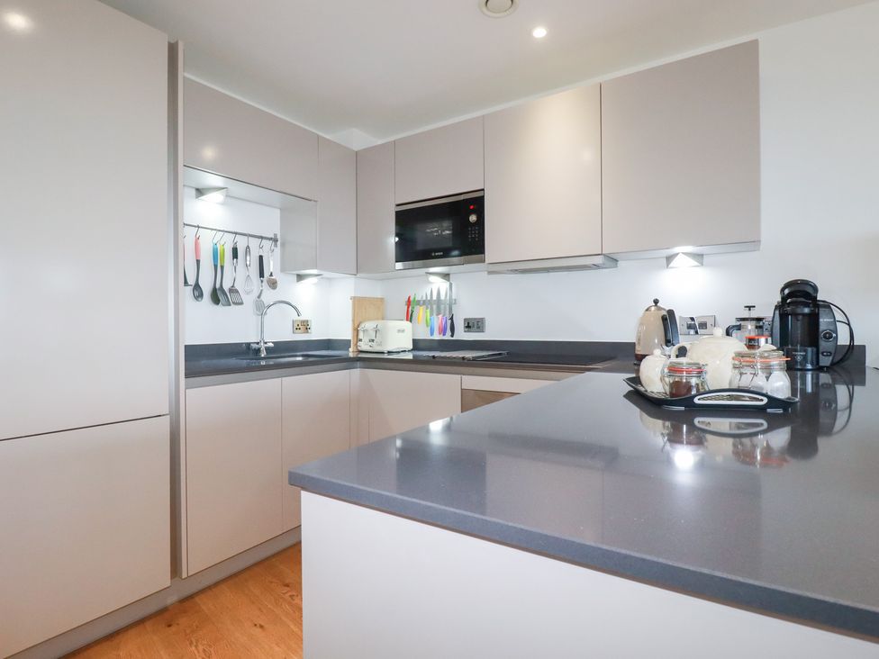 A kitchen with appliances and utensils at Apartment no.21 in Newquay