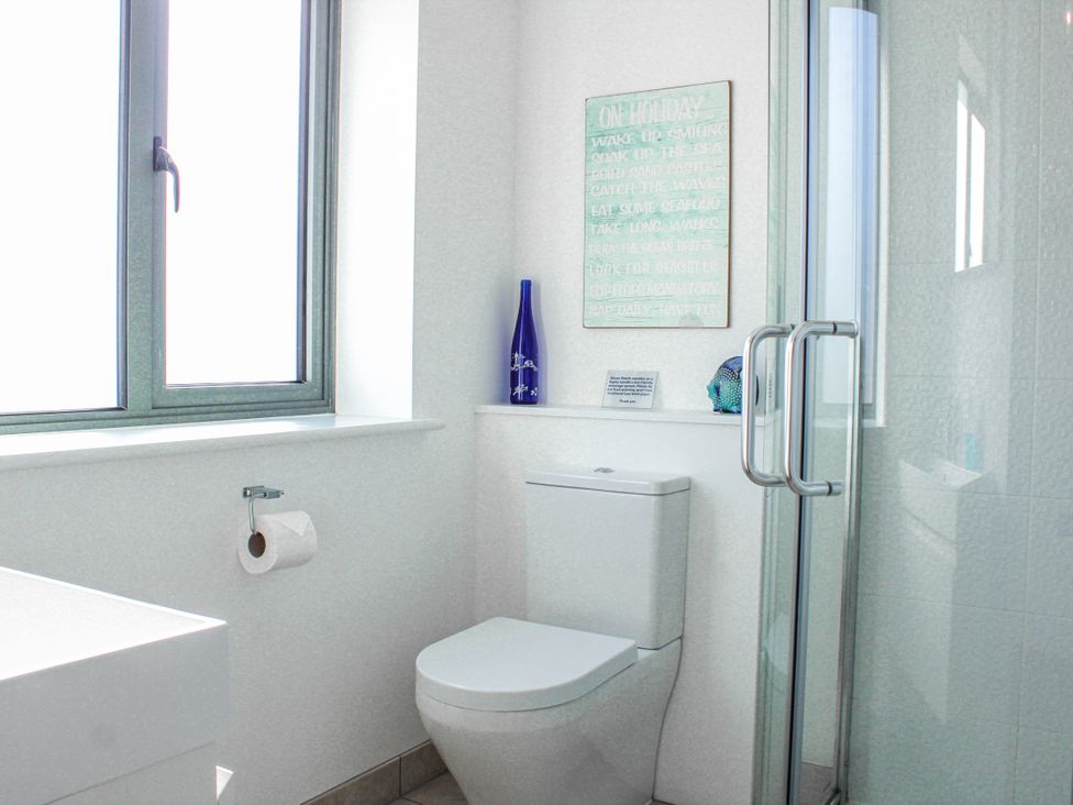 A bathroom with a shower and toilet at 4 Ocean Reach Bolberry