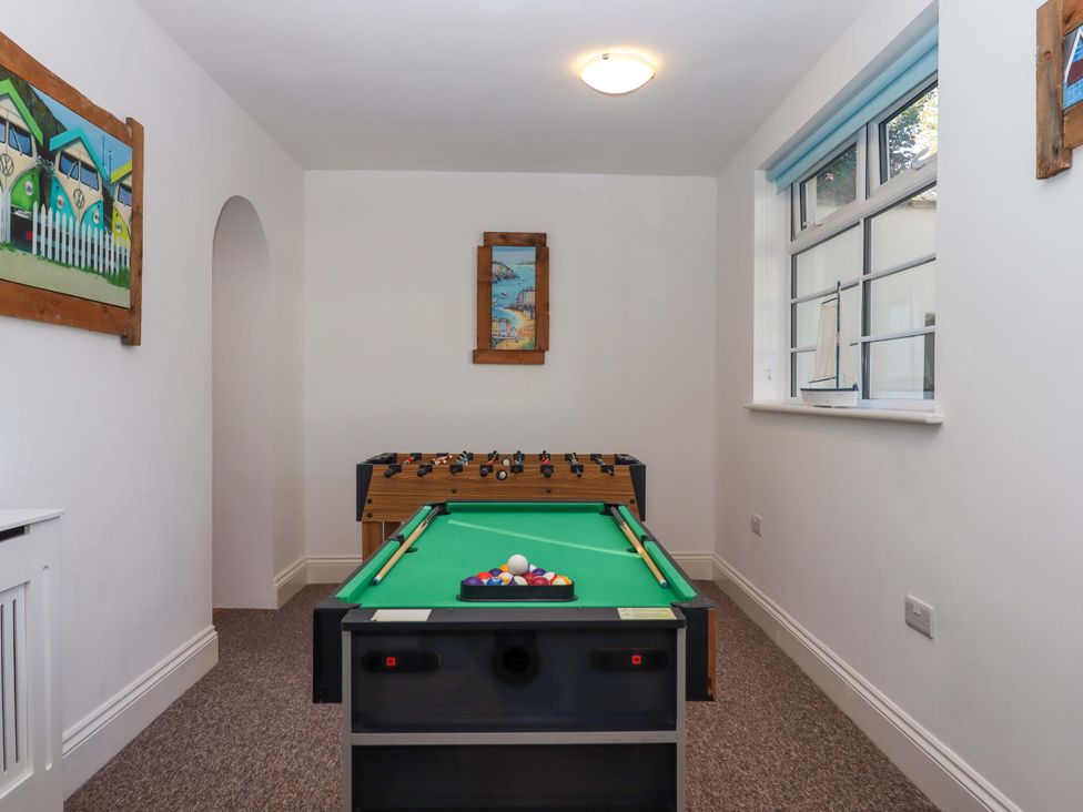 A game room with a pool table and a foosball table at Babbacombe Hall in Babbacombe