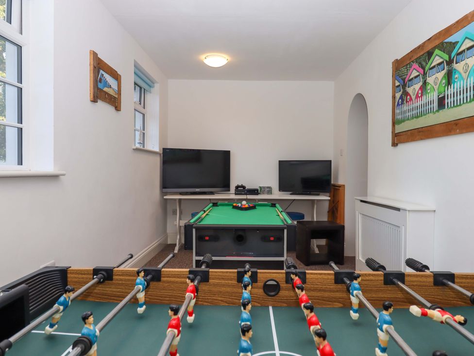 A game room with a table football and pool table at Babbacombe Hall Babbacombe