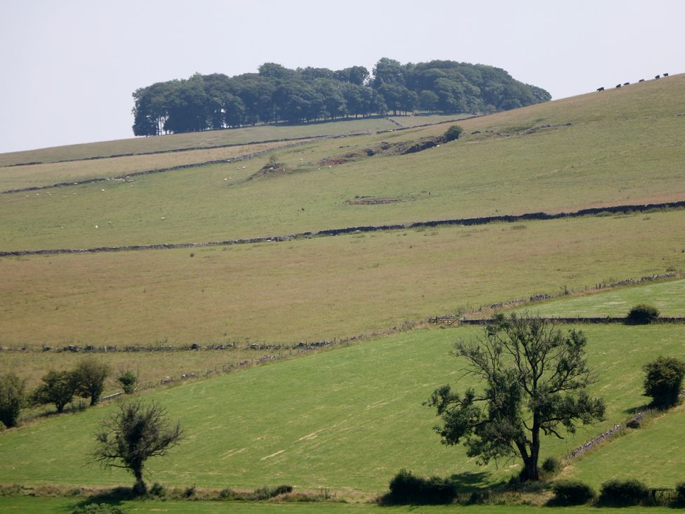 A landscape with hills and trees at Slade House in Ilam, Staffordshire
