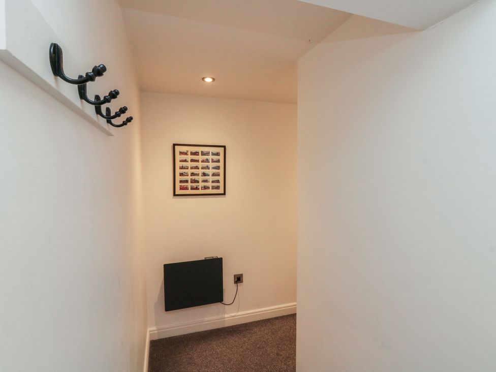 A hallway with coat hooks and a picture frame at Sir Nigel Gresley @ Engine Shed, Whitby