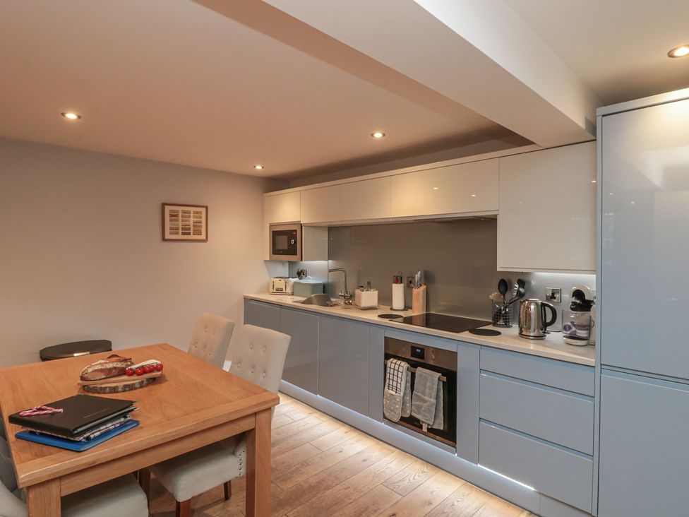 A kitchen with a table and chairs at Sir Nigel Gresley @ Engine Shed Whitby