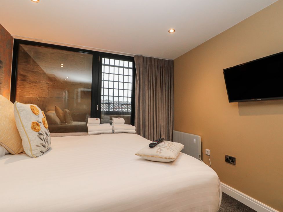 A bedroom with a bed and window at Sir Nigel Gresley @ Engine Shed in Whitby