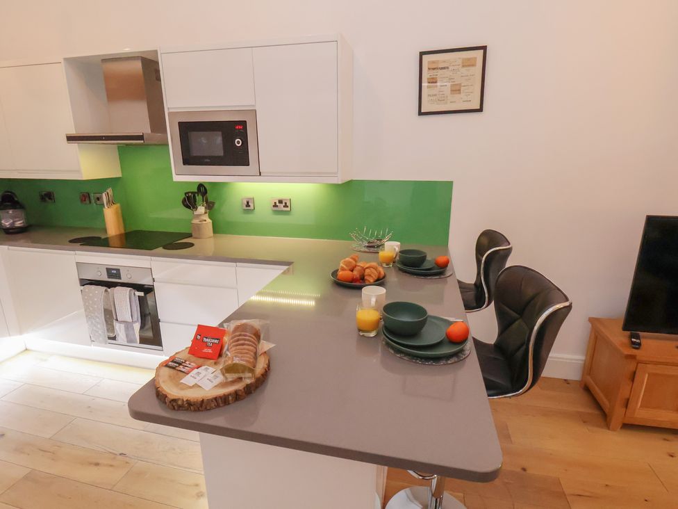 A kitchen with a countertop and dining setup at Repton @ Engine Shed in Whitby