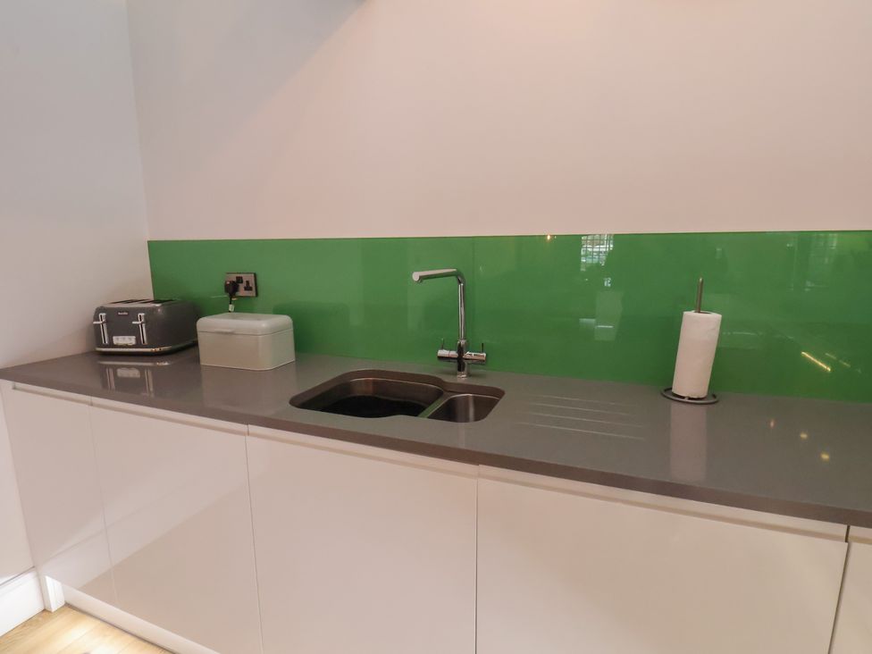 A kitchen with a sink and worktop at Repton @ Engine Shed Whitby