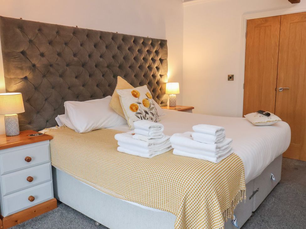 A bedroom with a bed and bedside tables at Repton @ Engine Shed in Whitby