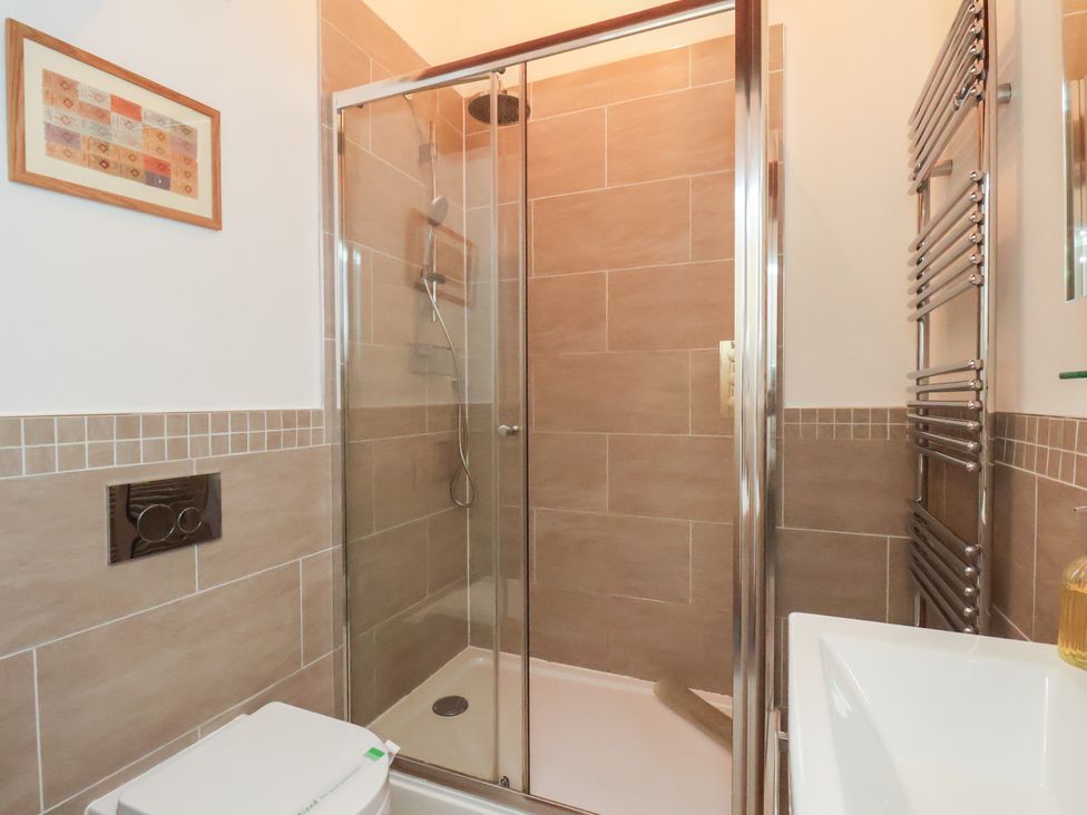 A bathroom with a shower and sink at Repton @ Engine Shed in Whitby