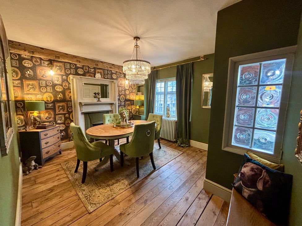 A dining room with a table and chairs at Liberty House in Ashbourne