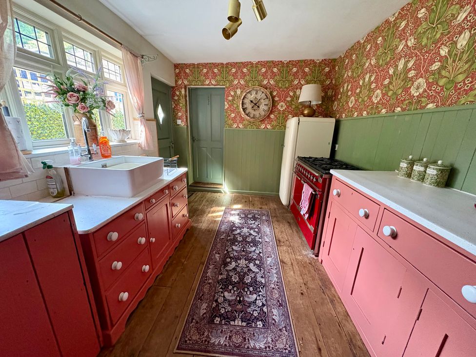 A kitchen with a sink and cooker at Liberty House in Ashbourne