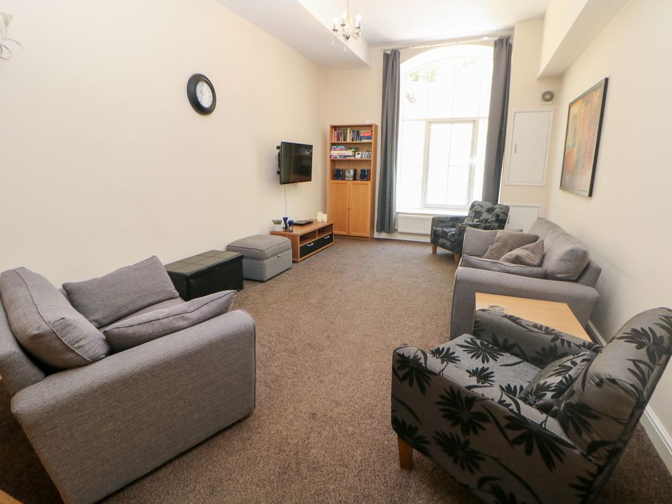 A living room with sofas and a television at Wye Apartment, Litton Mill in Litton Mill