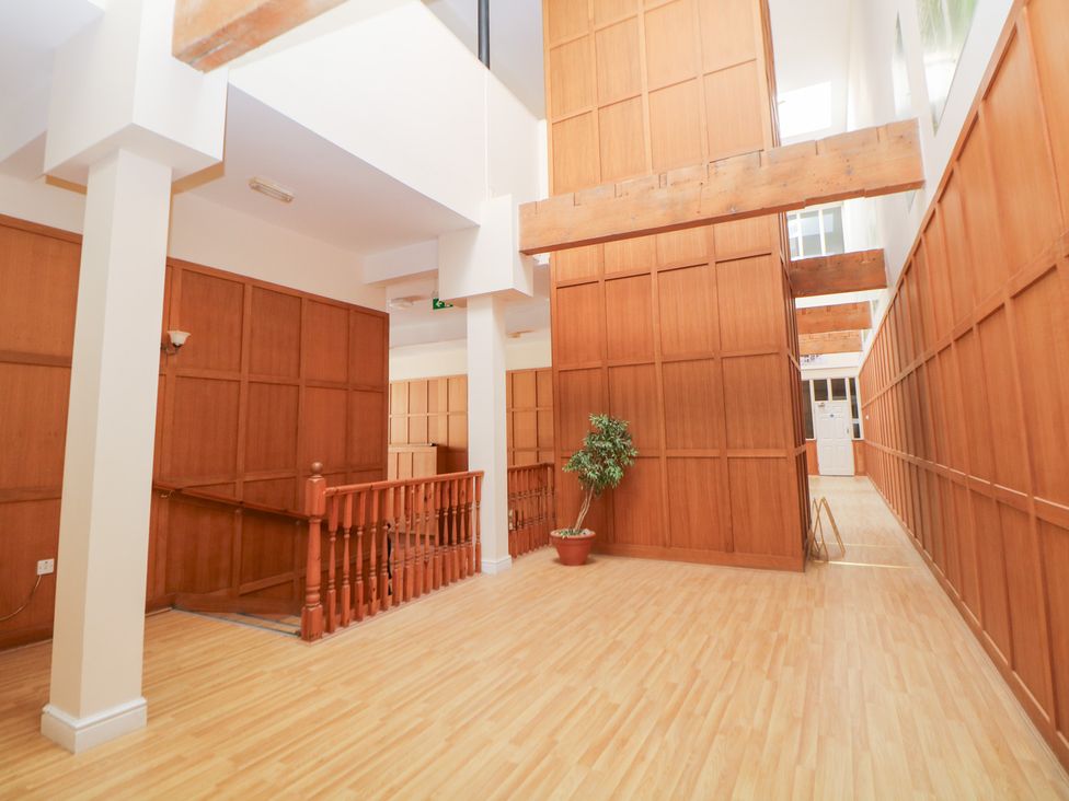 A hallway with wooden walls and railings at Wye Apartment, Litton Mill in Litton Mill