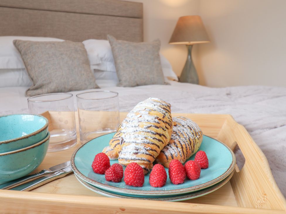 A tray with breakfast items in a bedroom at 5 Old Sail Loft Whitby